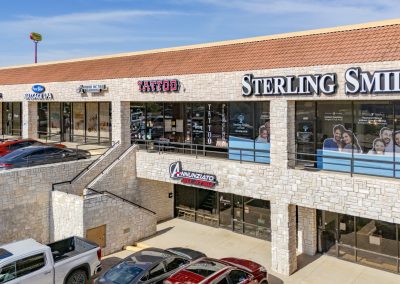 Storefronts at Park Place Plaza, a shopping center in Azle TX, including Sterling Smiles dentistry