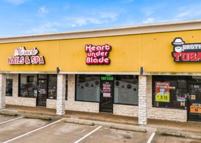 Several storefronts at the Santa Fe Shopping Center in Weatherford TX