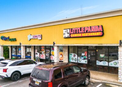 Storefronts for Little Panda Chinese Restaurant and TJ's Donuts at the Santa Fe Shopping Center in Weatherford TX