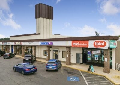 A row of bustling tenants with multiple cars out front at the Akers Center in Gastonia NC