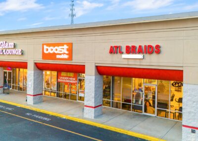 Storefronts for ATL Braids & Boost Mobile, tenants in the Montgomery Commons shopping center