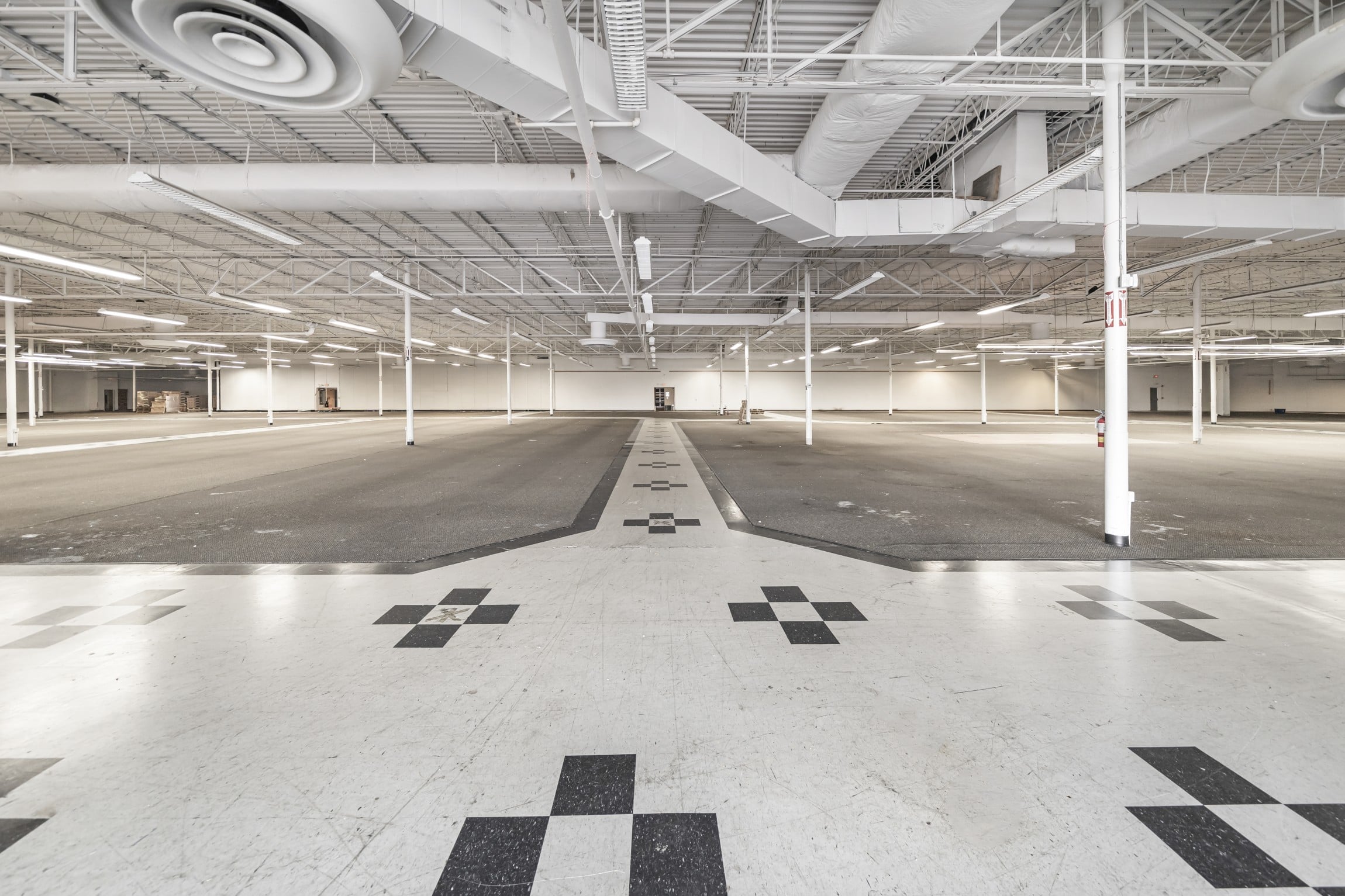 the huge empty showroom floor of the former mattress store at Hickory Commons