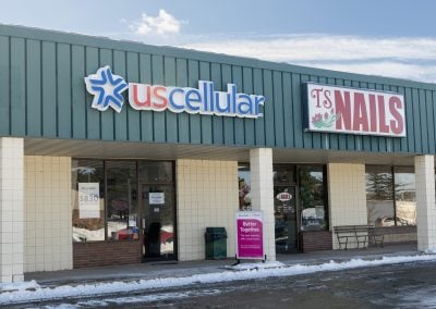 Storefronts of US Cellular and TS Nails in the Greentree Mall shopping center in Berlin WI
